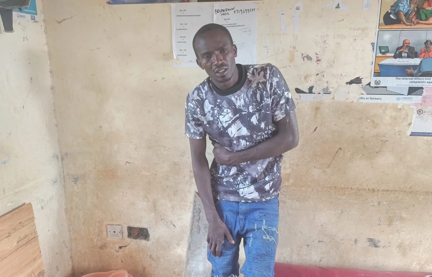 Calvin Okoli Ndimu, 27, arrested by DCI detectives in Nakuru County on October 13, 2026, after police recovered suspected stolen household goods, military clothing, and ammunition from his home.