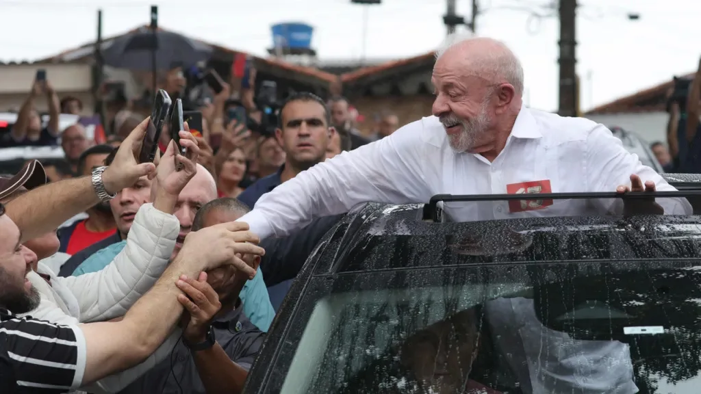 Lula greets supporters after casting his ballot on October 25, 2026
